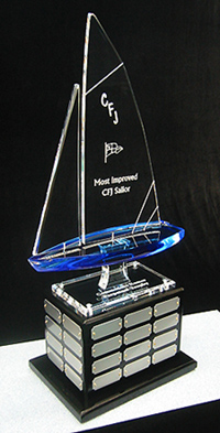 Perpetual sailing trophy with lusterous, black wooden base, 40 plates